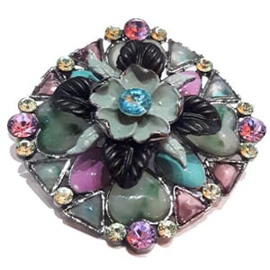 Brosje med blomstermotiv