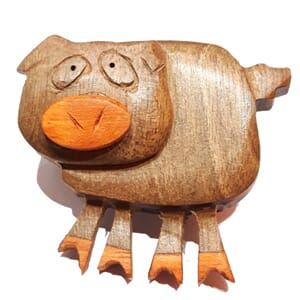 Brosje med grisemotiv