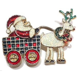Brosje med julenisse og reinsdyrmotiv