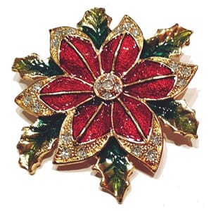 Brosje med juleblomst-motiv