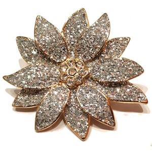 Brosje med juleblomst-motiv